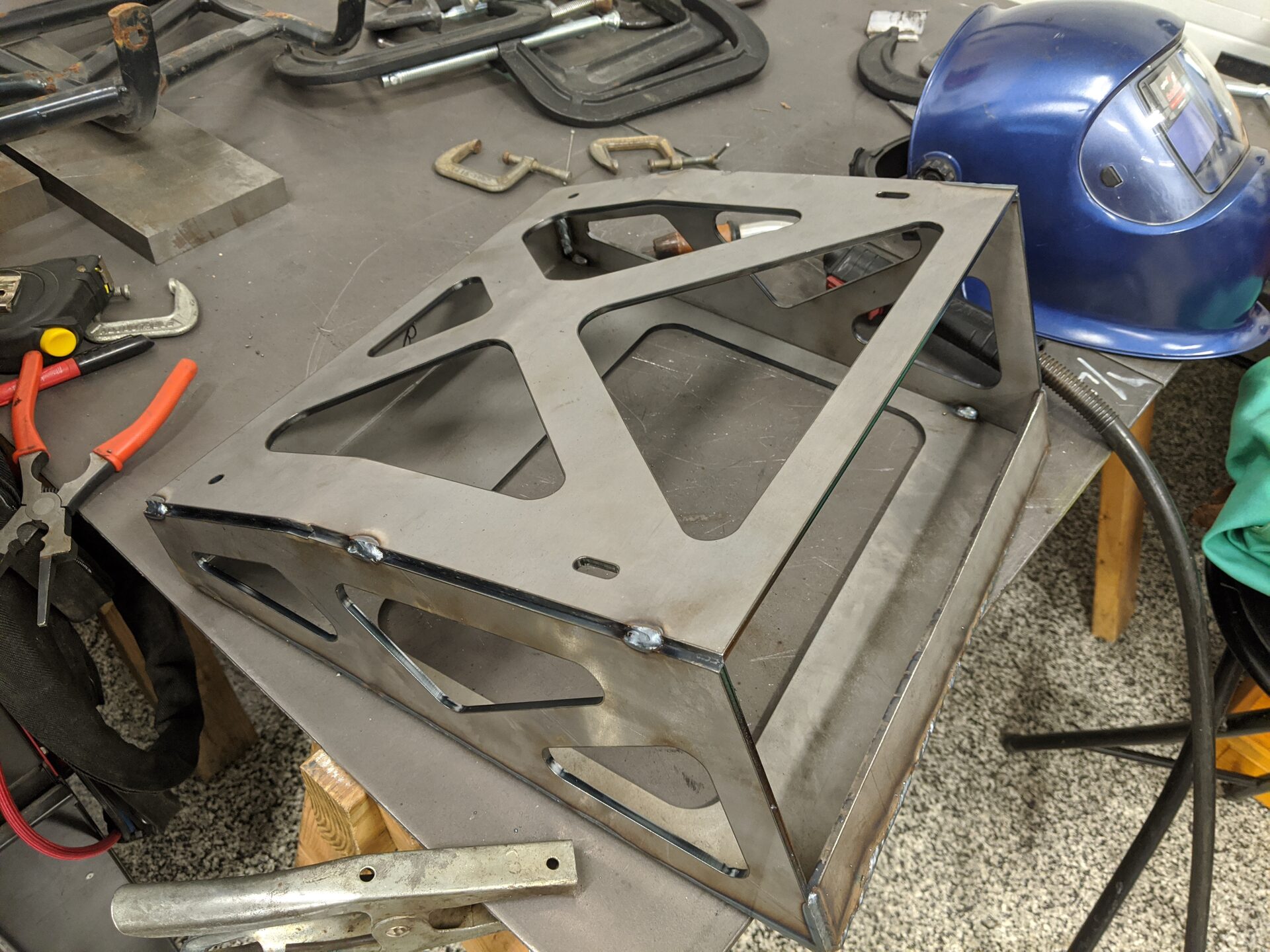 Custom fabricated steel seat bracket